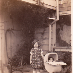 Mom Age 3 in the garden outside the family's flat on Pine St