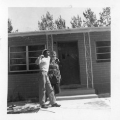 Eligio and Hilda at their first house. Look how proud he was of his new purchased home.