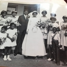 Daddy and Mummy with their bridesmaids and flower girls and page boy(Dad's nephew Sunny Emezie)
