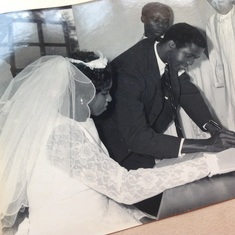 Daddy signing the wedding register.
