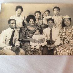 Sitting- De Sunday, Mummy carrying Ebere, Okon, Daddy. Standing from L-R are Aunty Evelyn(Dad's Niece), Da Agy carrying Chioma, Veronica