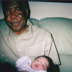 Carrying his grandchild, Nneoma Nnamani in London.