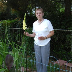 Liz with home grown Gladiola in back yard of Randolph Road home in Rockville, MD