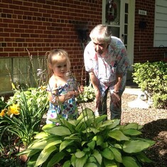 Granny with Betty Lewald.  Watering flowers in the front yard at 5103 Randolph Rd.