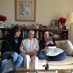 Liz with grandchildren, Wesley Melvin and Mary-Kate Lewald.  Looking over new iPad.