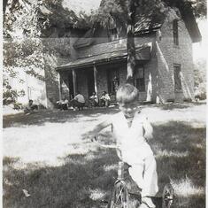 Ellion on tricycle at Aunt Esther's - est. 1944