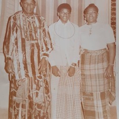 Elliott with his maternal grandad and mum in Warri