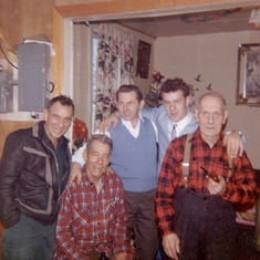 My grandpa,,my grannys 2 brothers in front row. My uncle murray in blue vest,,who has also passed.