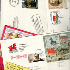 Collage of Randall’s colorful mail over the years—note his bright red Welsh dragon