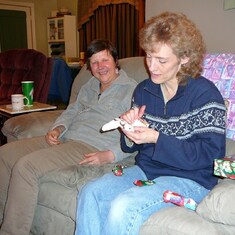 Opening Em's gifts (she always had a knack for that) -Christmas 2006
