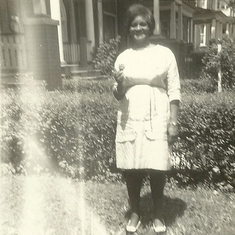 Mother visiting Canada, standing outside the house where we lived, located downtown Toronto, close to Dufferin St.