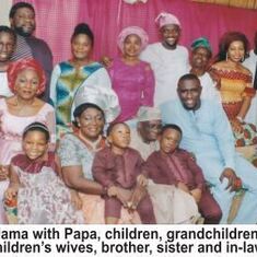 Eno with husband, children, grandchildren, children's wives, brother, sister and in-law