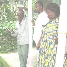 Infront of his grandparents grave in Buea