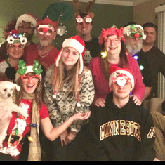 Crazy hat and glasses Christmas. Eric at back left next to Scott. Behind Carol.