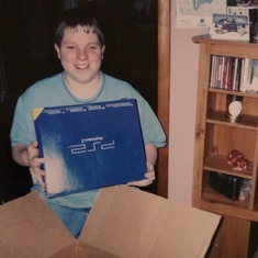 Receiving a PlayStation on Christmas Day.