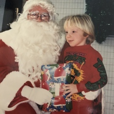 Receiving a gift from Santa. 