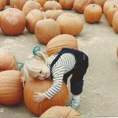 Erika is picking the perfect pumpkin!