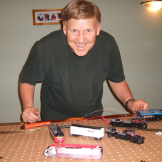 Playing with his train set - Sept 2010