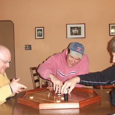 Don and Mark playing crockinole with Dad