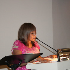 My step-sister in law, Sheila reading a poem titled "A beautiful garden."