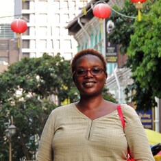 Aunty Esther posing in a street in China Town, Singapore.