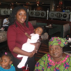 Mom at a restaurant with Bola and Kids