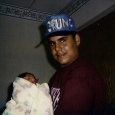 Uncle Juny holding his first niece Kayla Marie Sierra... the day Kayla was born... 8/2/93