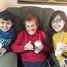 Enjoying a milkshake with her great-grandchildren!
