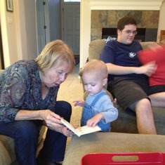 Gigi (great grandma) reading to great-grandson, Aidan.
