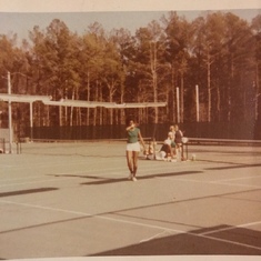 Mommy playing tennis
