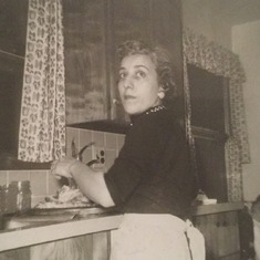 My Mom at home at the sink in her kitchen on Burton Ave. She kept her kitchen spotless at all times, was an amazing cook, and always had Lasgna in the freezer.