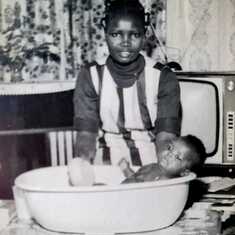 Mum giving Kayode his first Bath 