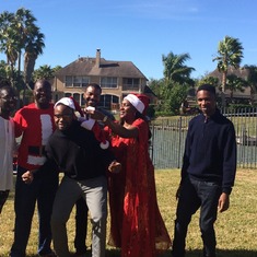Always the life of the gathering, Femi sparks up the Christmas family pic.