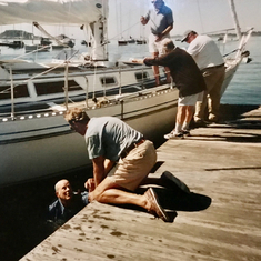 Forbes helping our father who fell into the drink when trying to get on (or off) Forbes sailboat Stonefire 1997.