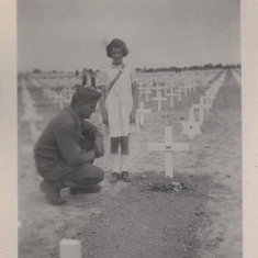 Before leaving Salzburg, Austria,  Forrest was granted permission to visit the grave of his brother, Robert, in Maargarten, Holland. He is pictured with a girl that had put flowers of Robert’s grave.