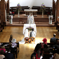 Fr.Martin in St.Paul's church officiating at a wedding blessing.