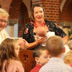 Inviting the children to come closer to see the baby being baptised, Rosie Pond's Baptism October 2016