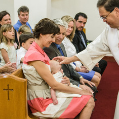 Fr. Rich baptizing Lucas Dean Moro.
