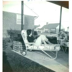 Mom relaxing on the carport 1962