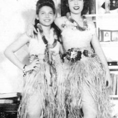 Aunt Vicki and Mom in their Hawaiian outfits
