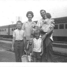 Trip to Minnesota: Stew, Mom Ruth, Dad holding Reta, and Mom's sister Velma's girls - Diane and Karen Sue (front)