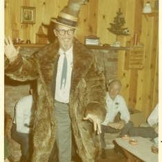 Dad in fur coat doing a jig