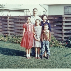 Anne, Dad Elaine, Frank J and Mom in backyard in the 50's