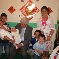 Dad with grandkids (Isabelle's baptism)