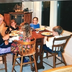 Papa dining with some of his grandkids.