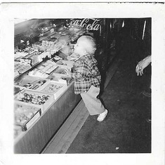 Gail looking at candy in parents Boyne city store