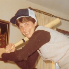 Gail "trying" to play baseball, in the house!