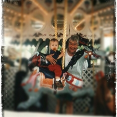 49 -  The Carousel - One of my favorite pictures because my Mom always LOVED carousels and greatly loved her grandson David shown here in Florida.