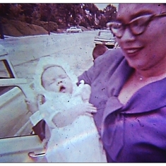 53 - Overjoyed and so proud holding her first daughter Laurie on her Christening Day, Circa 1961