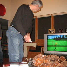 Thanksgiving at Dune Acres. Dad playing Wii golf. (2008)
